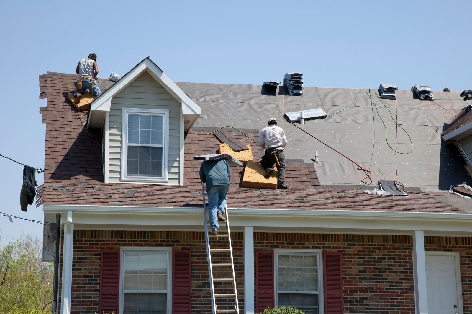 Professional roofing crew working on a residential roof in New Jersey